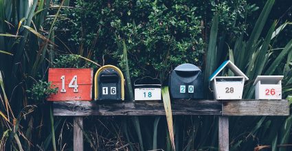 An assorted group of American style, numbered mail boxes 