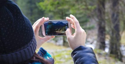 A person using a phone to take pictures 