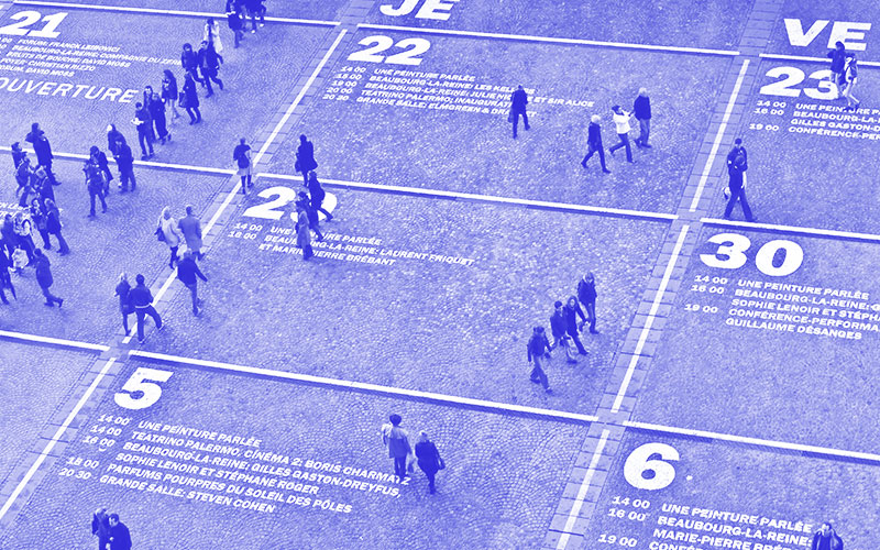 Ariel shot of lots of people walking around on a numbered grid