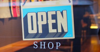 An Open sign in a shop window