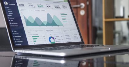 A laptop displaying stats