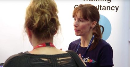 People discussing a business at an exhibition 