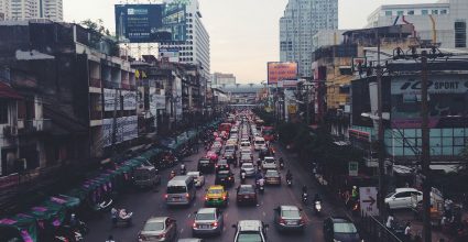 A busy City street full of cars