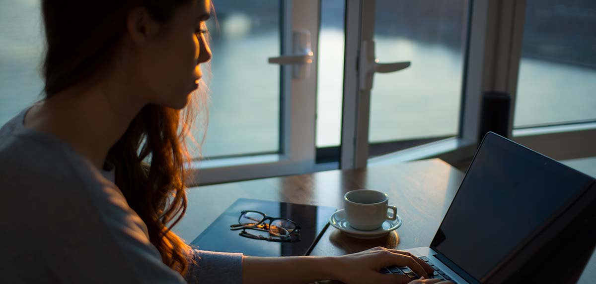 Woman typing on a laptop
