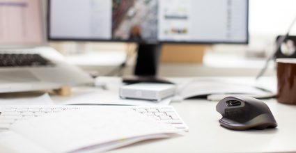 Desk with Mouse, laptop and monitor